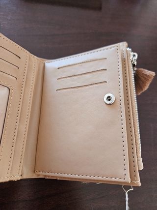 Cartera tejida beige y rosa con borla