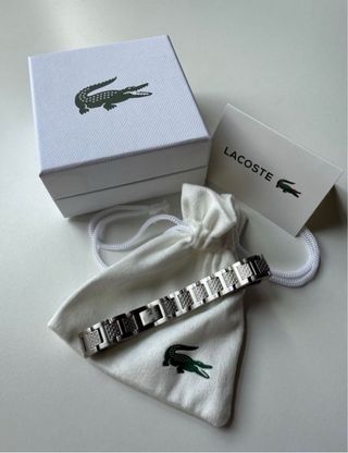 Pulsera Lacoste metal negro, dorado, plateado