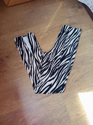 Pantalones flare animal print con abertura