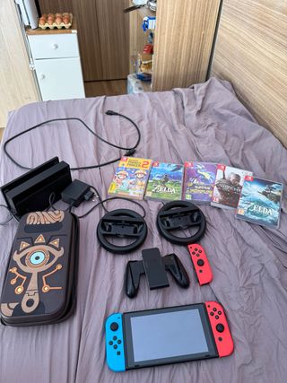Nintendo Switch con funda Zelda+2 juegos