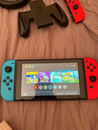 Nintendo Switch con funda Zelda+2 juegos