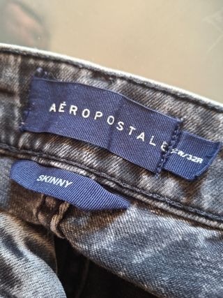 Pantalones skinny rotos grises