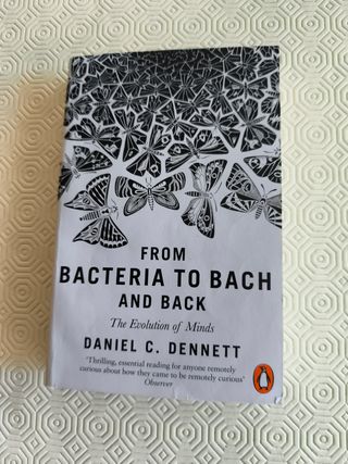 From Bacteria to Bach and Back