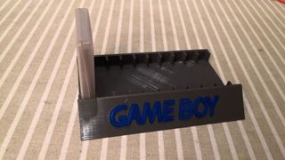Soporte expositor 10 juegos Gameboy con funda