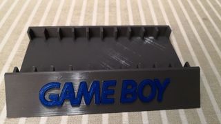 Soporte expositor 10 juegos Gameboy con funda