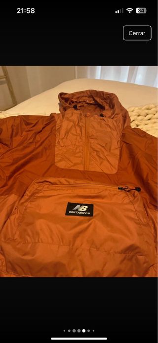 Chubasquero cortavientos New Balance naranja