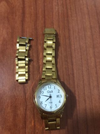Reloj G&B Dorado que marca el día del mes. Nuevo!!