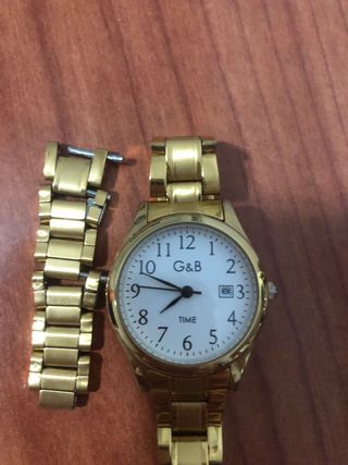 Reloj G&B Dorado que marca el día del mes. Nuevo!!