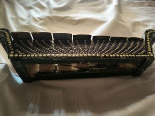 Xilófono de metal con baqueta