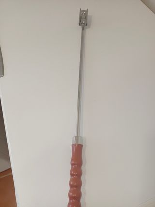 Raspador para caballos con mango