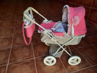 Carrito de muñecas rosa