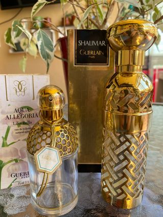 Bottiglie d'oro vuote Guerlain