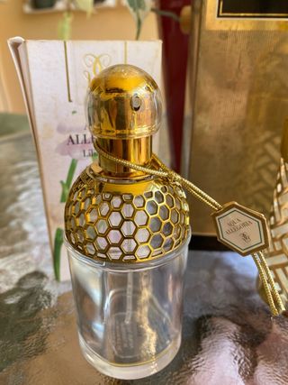 Bottiglie d'oro vuote Guerlain
