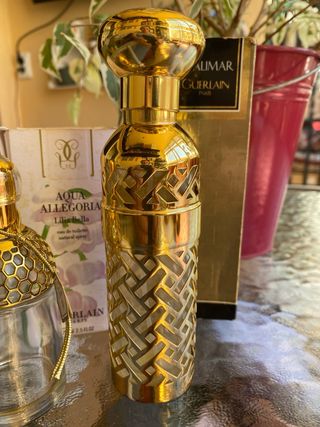 Bottiglie d'oro vuote Guerlain