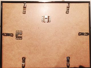 Quadro con stampa e cornice nera in plastica