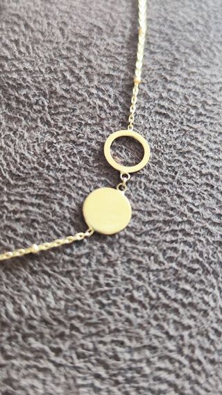 Pulsera de oro con círculos y bolitas chica nueva.