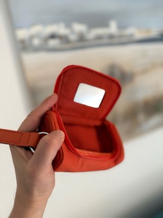 Trousse Piquadro arancione con portachiavi