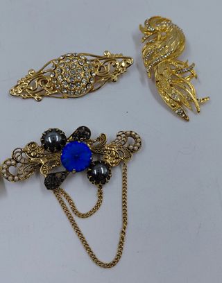 Tre spille bigiotteria dorate