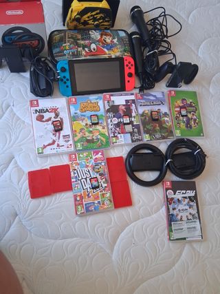 Nintendo Switch + Accesorios y Juegos +2 micrófono