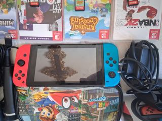 Nintendo Switch + Accesorios y Juegos +2 micrófono