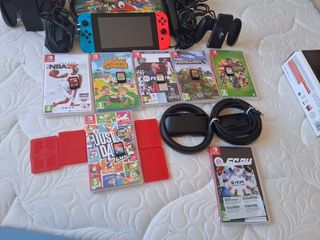 Nintendo Switch + Accesorios y Juegos +2 micrófono