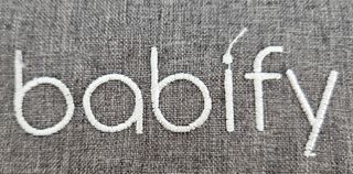 Trona de viaje Babify con almacenamiento