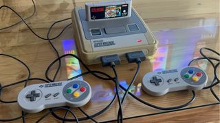 SNES con Super Mario All-Stars y 2 mandos