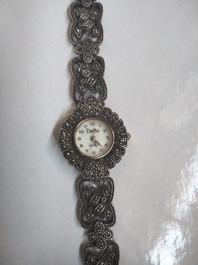 Reloj Delta Plata y Marquesitas