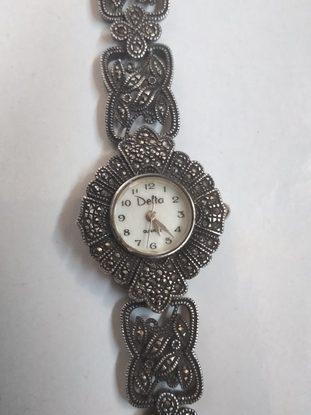 Reloj Delta Plata y Marquesitas