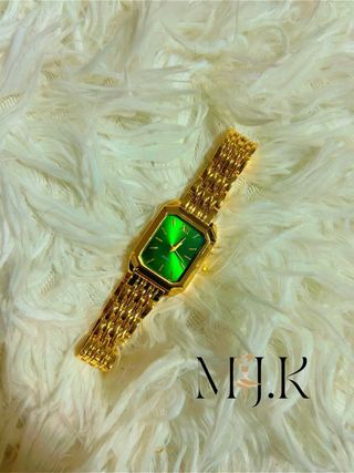 Orologio da polso dorato con quadrante verde