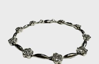 Pulsera semirígida flores circonitas de oro blanco 18K