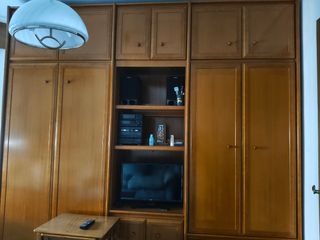 Mueble de salón con cama