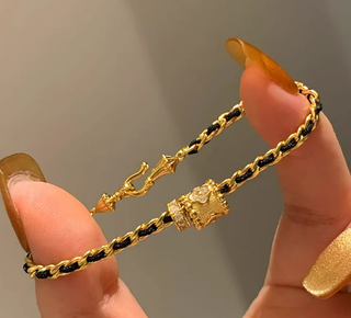Pulsera de oro y negro de segunda mano