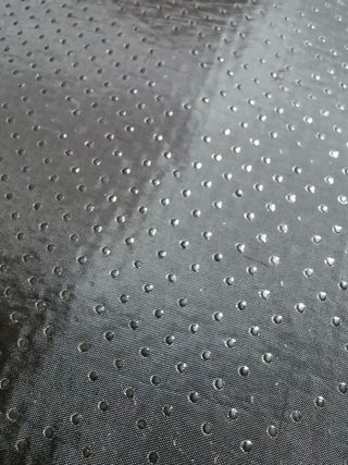 Cama para perro beige y multicolor