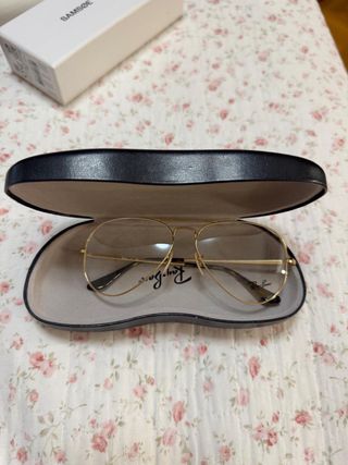 Gafas de sol Ray-Ban doradas y marrones