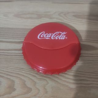 Set Coca Cola: portasigarette, tagliapizza + CD