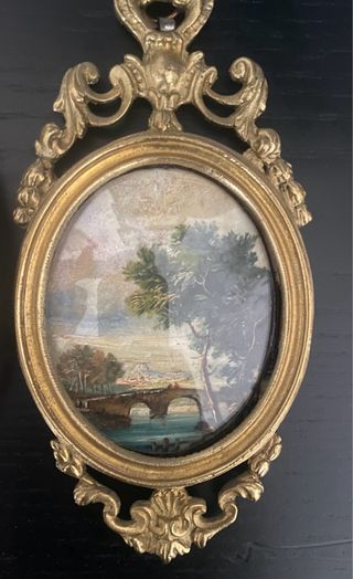 Quadretti ovali dorati con paesaggi