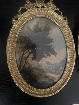 Quadretti ovali dorati con paesaggi