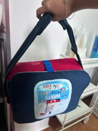 Trona portátil para bebé con diseño de peces.