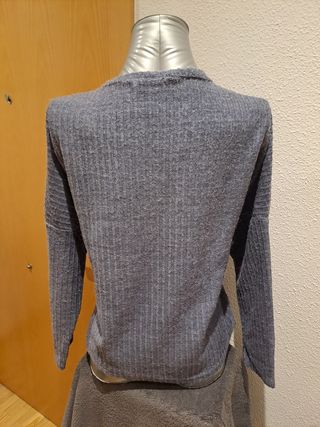 Jersey gris con bolsillos de lentejuelas