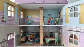 Casa de muñecas morada y gris