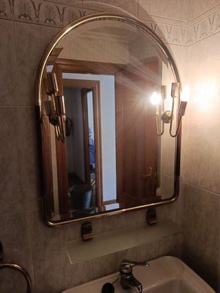 Espejo de pared dorado y cristal