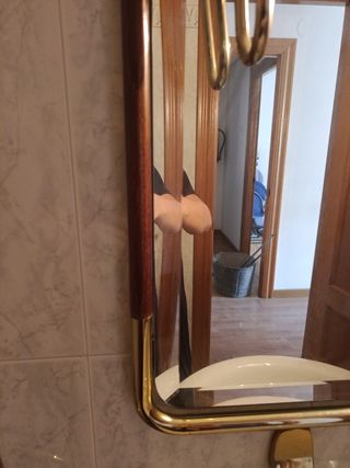 Espejo de pared dorado y cristal