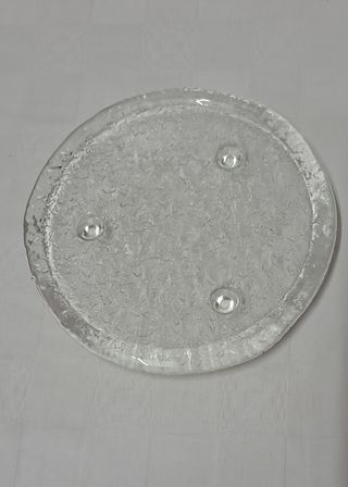 Sottopentola rotondo in vetro con piedini