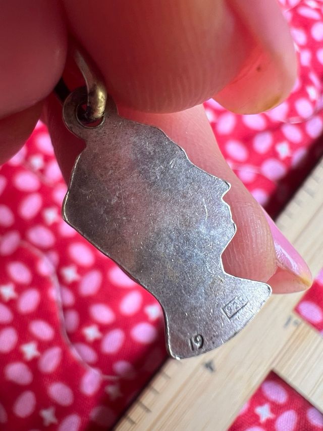 Colgante antiguo perfil cara plata