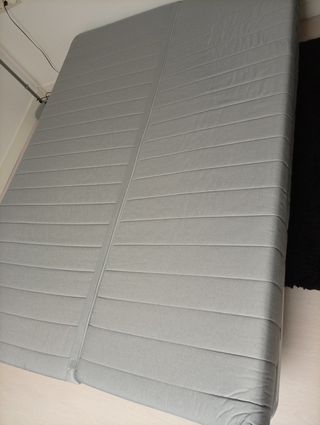 Sofá cama de Ikea con funda turquesa
