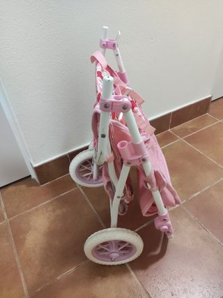 Cochecito gemelar de juguete rosa