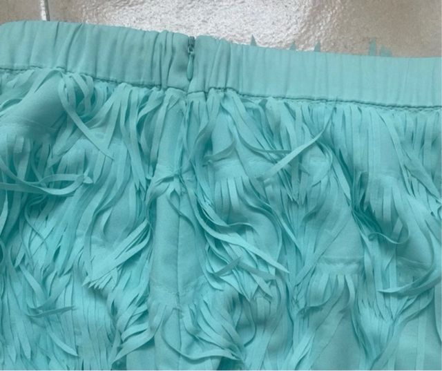 Falda turquesa con flecos