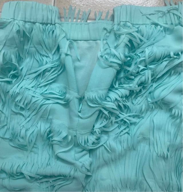 Falda turquesa con flecos