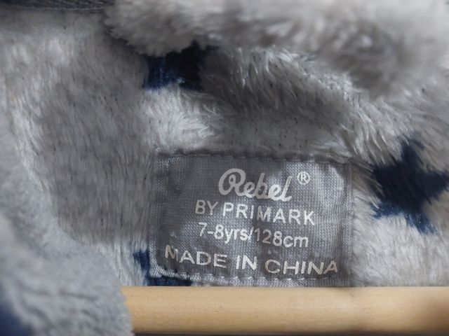 Bata estrellas gris Primark 7-8 años